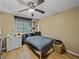 Bedroom with a double bed, dresser, and ceiling fan at 1008 Highgrove Ct, Valrico, FL 33596