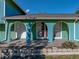 Arched entryway with tiled flooring and landscaping at 1008 Highgrove Ct, Valrico, FL 33596