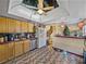 Well-equipped kitchen with wood cabinets and skylight at 1008 Highgrove Ct, Valrico, FL 33596