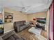 Bright living room featuring a cozy seating area at 1008 Highgrove Ct, Valrico, FL 33596
