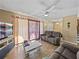 Spacious living room with wood floors and comfy sofas at 1008 Highgrove Ct, Valrico, FL 33596