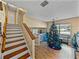 Upstairs hallway with Christmas tree and staircase at 1008 Highgrove Ct, Valrico, FL 33596