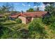 Home with a screened-in patio and lush landscaping at 1813 Laurel Oak Dr, Valrico, FL 33596