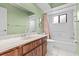 Bathroom with shower/tub combo and wood vanity at 1813 Laurel Oak Dr, Valrico, FL 33596