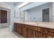 Double vanity bathroom with wood cabinets at 1813 Laurel Oak Dr, Valrico, FL 33596