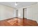 Bedroom with hardwood floors and double door closet at 1813 Laurel Oak Dr, Valrico, FL 33596