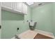 Laundry room with cabinets and a utility sink at 1813 Laurel Oak Dr, Valrico, FL 33596