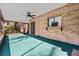 Bright screened porch features a ceiling fan at 1813 Laurel Oak Dr, Valrico, FL 33596
