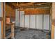 Interior of a small workshop with wooden shelves and workbench at 1813 Laurel Oak Dr, Valrico, FL 33596