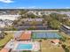 Community pool, tennis court, and parking area at 3055 Casa Del Sol Cir # 208, Clearwater, FL 33761