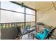 Relaxing screened balcony with seating area, perfect for outdoor enjoyment at 3055 Casa Del Sol Cir # 208, Clearwater, FL 33761