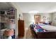 Bedroom with double bed, dresser, and spacious closet at 3055 Casa Del Sol Cir # 208, Clearwater, FL 33761