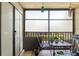 Enclosed patio with seating and a small table at 3055 Casa Del Sol Cir # 208, Clearwater, FL 33761
