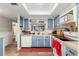 Updated kitchen with light blue cabinets and new flooring at 3055 Casa Del Sol Cir # 208, Clearwater, FL 33761