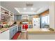 Updated kitchen with light blue cabinets and new flooring at 3055 Casa Del Sol Cir # 208, Clearwater, FL 33761
