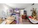 Spacious living room featuring comfortable seating and a decorative Christmas tree at 3055 Casa Del Sol Cir # 208, Clearwater, FL 33761
