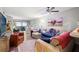 Living room with sectional sofa and adjacent dining area at 3055 Casa Del Sol Cir # 208, Clearwater, FL 33761