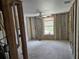 Unfinished bedroom with new window and flooring at 10436 Raymond St, Englewood, FL 34224
