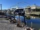 Private boat lift on a canal with a covered structure at 10436 Raymond St, Englewood, FL 34224