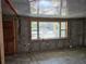 Unfinished living room with large window and tile floors at 10436 Raymond St, Englewood, FL 34224