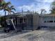 Damaged screened patio in need of repair at 10436 Raymond St, Englewood, FL 34224