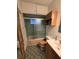 Clean bathroom with shower/tub combo and wood vanity at 2700 9Th N Ave, St Petersburg, FL 33713