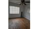Simple bedroom with hardwood floors and window coverings at 2700 9Th N Ave, St Petersburg, FL 33713