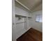 Double-door closet with hanging rods and shelving at 2700 9Th N Ave, St Petersburg, FL 33713