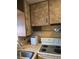 Corner of kitchen with stove, microwave and ice maker at 2700 9Th N Ave, St Petersburg, FL 33713