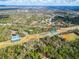 Aerial view of the community shows tennis courts, pool and a baseball field at 5808 Falconcreek Pl, Lithia, FL 33547