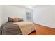 Bedroom featuring hardwood floors, neutral paint, a window, and a ceiling fan at 5808 Falconcreek Pl, Lithia, FL 33547