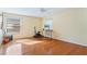 Bedroom with hardwood floors, neutral paint, multiple windows, and a ceiling fan at 5808 Falconcreek Pl, Lithia, FL 33547