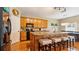 Spacious kitchen featuring a large island with breakfast bar and pendant lighting at 5808 Falconcreek Pl, Lithia, FL 33547