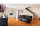 Comfortable living room featuring hardwood floors, comfortable furnishings, and an open layout at 5808 Falconcreek Pl, Lithia, FL 33547