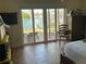 Bedroom with water views and access to deck at 1371 Sea Gull S Dr, St Petersburg, FL 33707