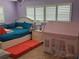 Bedroom with a queen bed and a play area at 1371 Sea Gull S Dr, St Petersburg, FL 33707