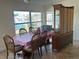 Bright dining room with water views and wood table at 1371 Sea Gull S Dr, St Petersburg, FL 33707