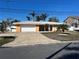 Single-story home with a white garage door and a brick driveway at 1371 Sea Gull S Dr, St Petersburg, FL 33707