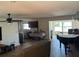 Open living room with kitchen and piano at 1371 Sea Gull S Dr, St Petersburg, FL 33707