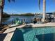 Relaxing pool area with colorful chairs and waterfront views at 1371 Sea Gull S Dr, St Petersburg, FL 33707