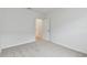 Spacious bedroom with grey carpet and access to hallway at 5213 Patano Loop, Palmetto, FL 34221