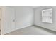 Well-lit bedroom with grey carpet and a window with blinds at 5213 Patano Loop, Palmetto, FL 34221