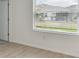 Bedroom with tile flooring and a window overlooking the backyard at 5213 Patano Loop, Palmetto, FL 34221