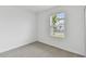 Light and airy bedroom featuring a window and neutral decor at 5213 Patano Loop, Palmetto, FL 34221