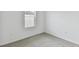 Bright bedroom with window and neutral carpeting at 5213 Patano Loop, Palmetto, FL 34221