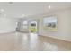 Open living area with tile floors and sliding glass doors at 5213 Patano Loop, Palmetto, FL 34221