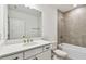 Clean bathroom, white vanity, and tile shower/tub combo at 5217 Patano Loop, Palmetto, FL 34221