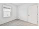 Simple bedroom with grey carpet and window at 5217 Patano Loop, Palmetto, FL 34221