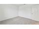 Spacious bedroom with grey carpet and an additional door at 5217 Patano Loop, Palmetto, FL 34221