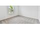 Well-lit bedroom with grey carpet and window with blinds at 5217 Patano Loop, Palmetto, FL 34221